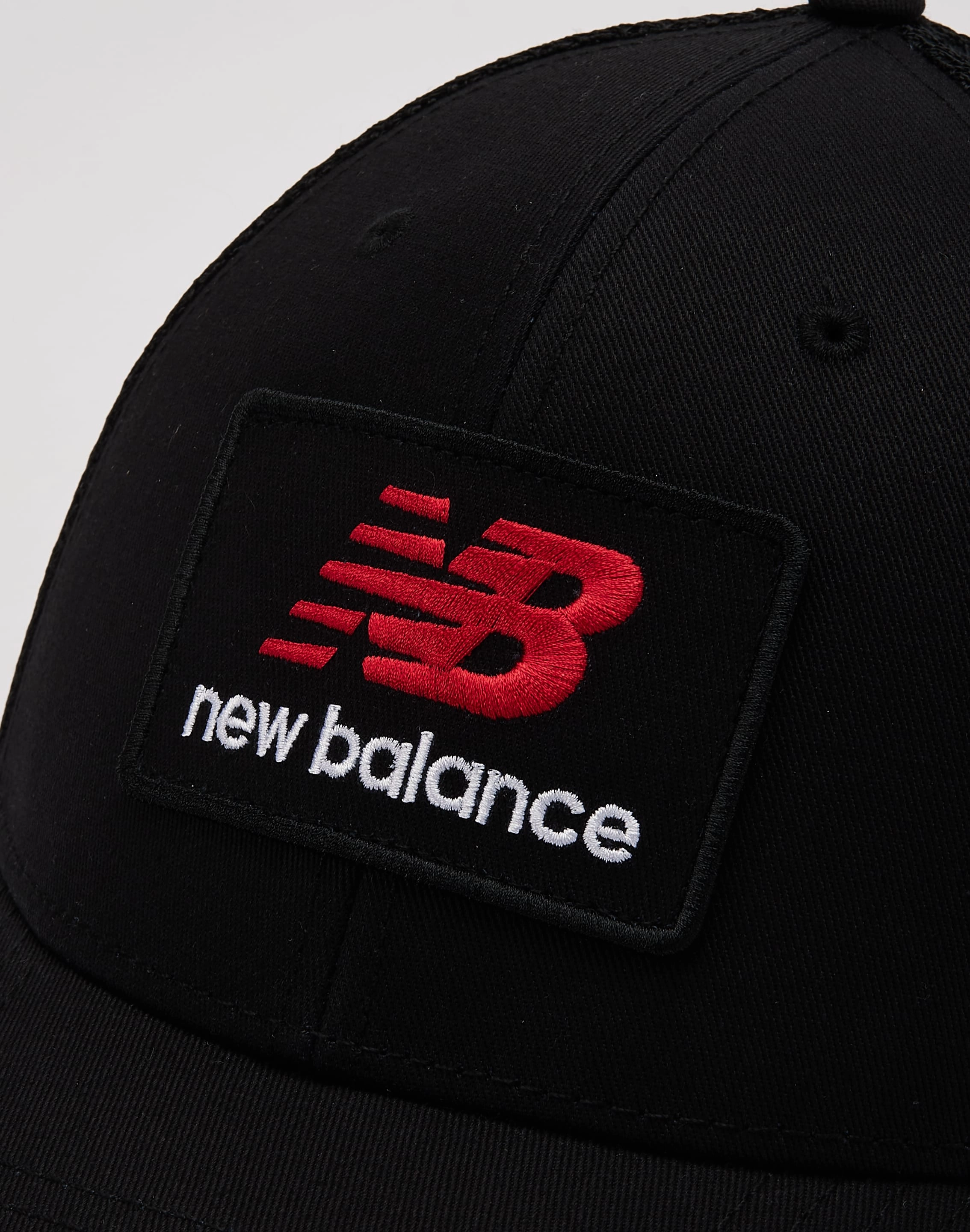 New Balance Stacked Patch Logo Trucker Hat